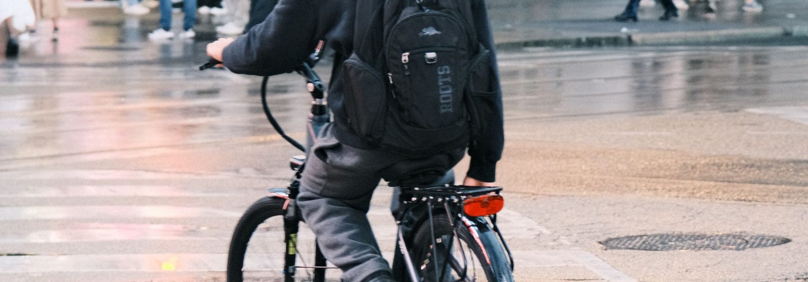 Cyclist on a wet city street